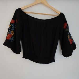 off-the-shoulder black blouse